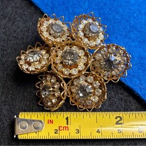 Vintage clear broach w all Rhinestones in place.